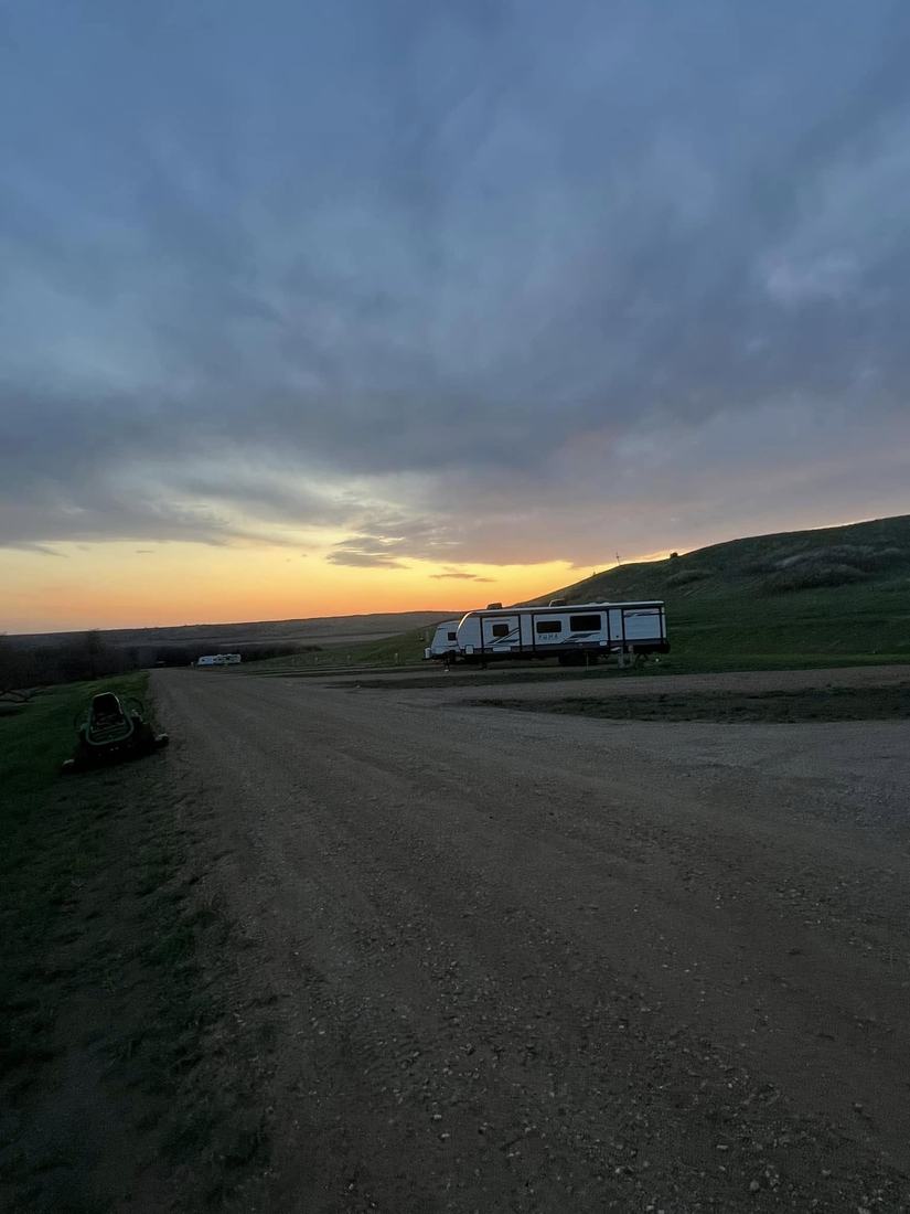 Sunset over the park drive and RVs